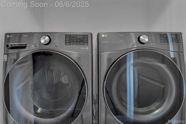 137 Monument Ln, Wixom, MI 48393 - washroom with washing machine and clothes dryer and mail area