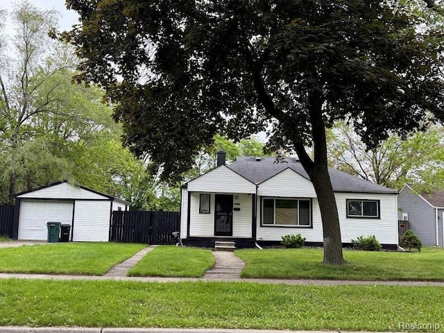 20760 Ridgedale St, Oak Park, MI 48237 - view of front of house featuring a detached garage and an outbuilding