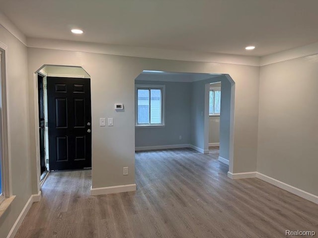 20760 Ridgedale St, Oak Park, MI 48237 - foyer featuring arched walkways, wood finished floors, recessed lighting, and baseboards