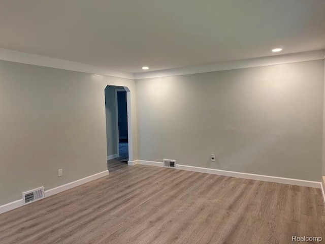 20760 Ridgedale St, Oak Park, MI 48237 - unfurnished room with arched walkways, recessed lighting, baseboards, and light wood-style floors