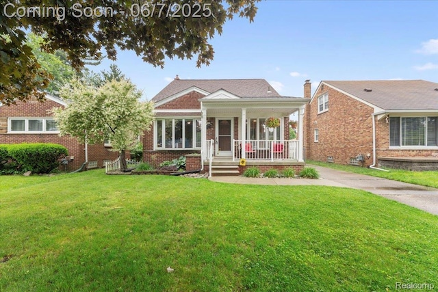 8148 Buckingham Ave, Allen Park, MI 48101 - view of front of house with a porch, a front lawn, and brick siding