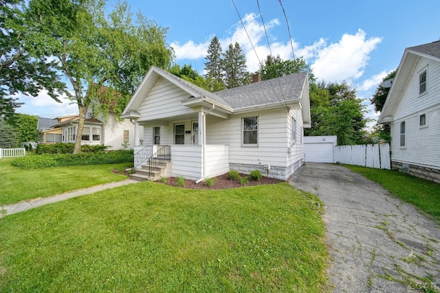 174 W Mansion St, Jackson, MI 49203 - bungalow featuring roof with shingles, a chimney, and a porch