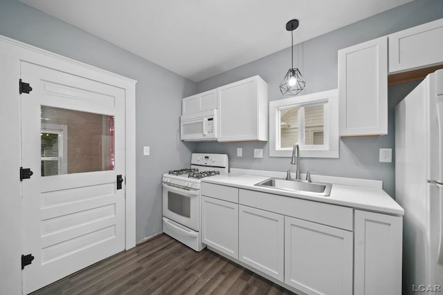 174 W Mansion St, Jackson, MI 49203 - kitchen with white appliances, a sink, white cabinets, light countertops, and dark wood-type flooring