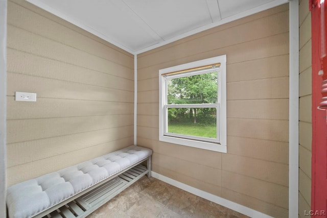 174 W Mansion St, Jackson, MI 49203 - living area featuring baseboards and wooden walls