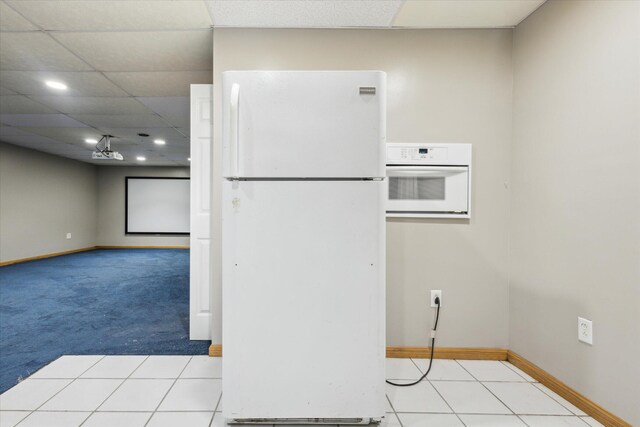 502 Woodland Dr, Buchanan, MI 49107 - kitchen with white appliances, baseboards, recessed lighting, and carpet floors