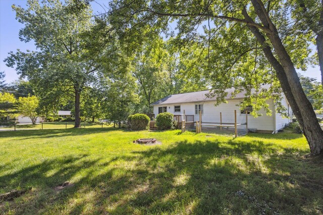 502 Woodland Dr, Buchanan, MI 49107 - view of yard with a fire pit and a wooden deck
