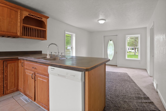 238 Long Ave, Michigan Center, MI 49254 - kitchen with dishwasher, a sink, dark countertops, plenty of natural light, and a textured ceiling