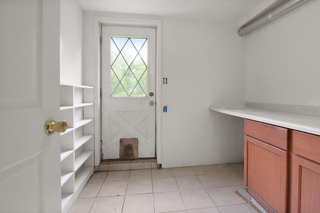 238 Long Ave, Michigan Center, MI 49254 - doorway to outside with light tile patterned floors