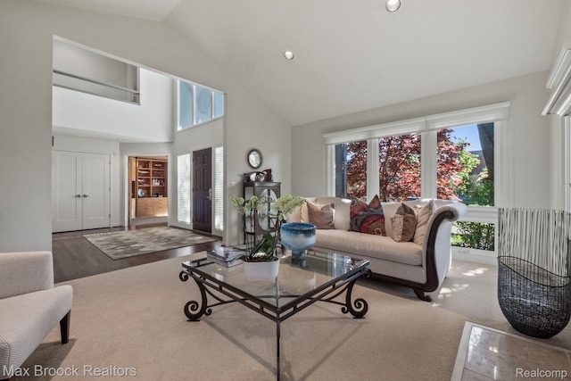 6566 Bristol Dr, West Bloomfield, MI 48322 - living area with plenty of natural light, high vaulted ceiling, and wood finished floors