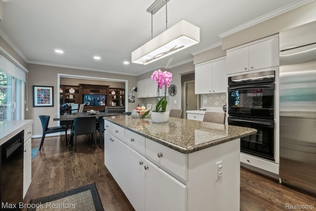 6566 Bristol Dr, West Bloomfield, MI 48322 - kitchen with black appliances, a center island, recessed lighting, white cabinetry, and crown molding