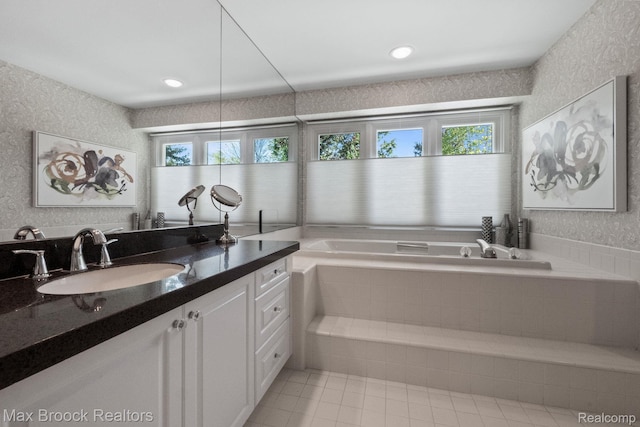 6566 Bristol Dr, West Bloomfield, MI 48322 - bathroom with healthy amount of natural light, a garden tub, vanity, tile patterned floors, and wallpapered walls