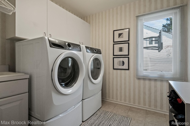 6566 Bristol Dr, West Bloomfield, MI 48322 - laundry room with wallpapered walls, washer and dryer, baseboards, plenty of natural light, and cabinet space
