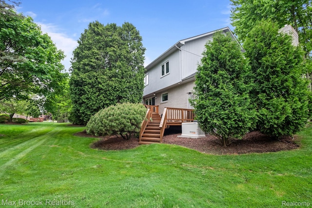 6566 Bristol Dr, West Bloomfield, MI 48322 - view of green lawn featuring stairs and a deck