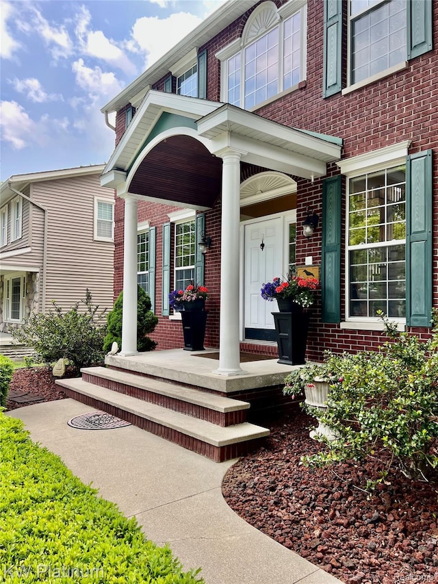 3105 E Woodland Dr, Port Huron, MI 48060 - property entrance featuring brick siding and covered porch