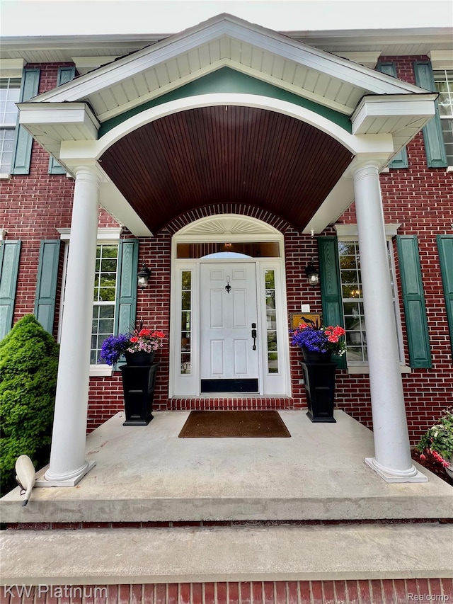 3105 E Woodland Dr, Port Huron, MI 48060 - property entrance featuring a porch and brick siding
