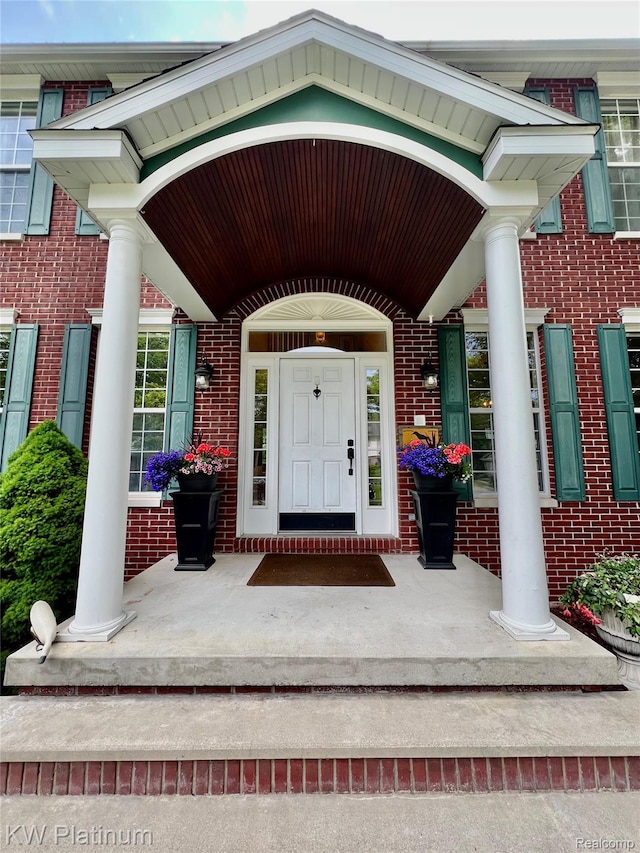 3105 E Woodland Dr, Port Huron, MI 48060 - property entrance with a porch and brick siding