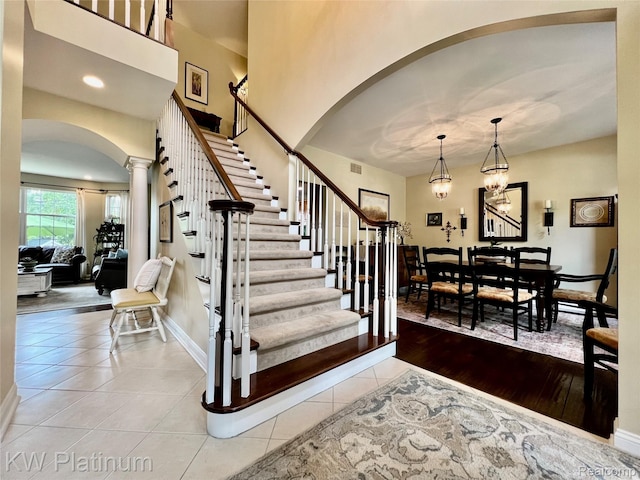 3105 E Woodland Dr, Port Huron, MI 48060 - stairway with arched walkways, ornate columns, and tile patterned flooring