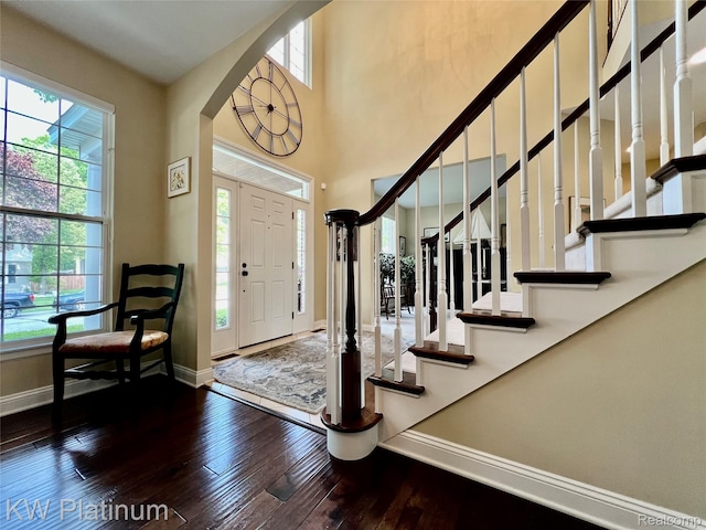 3105 E Woodland Dr, Port Huron, MI 48060 - entryway featuring plenty of natural light, hardwood / wood-style flooring, arched walkways, stairway, and a high ceiling