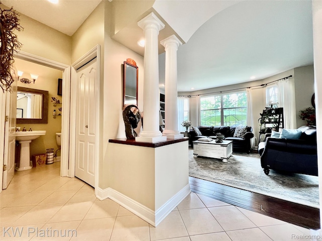 3105 E Woodland Dr, Port Huron, MI 48060 - hall featuring decorative columns and light tile patterned floors