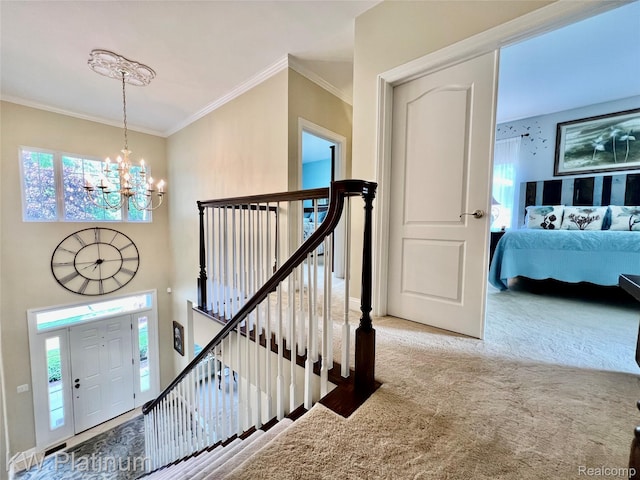 3105 E Woodland Dr, Port Huron, MI 48060 - carpeted foyer entrance featuring a chandelier, crown molding, and plenty of natural light