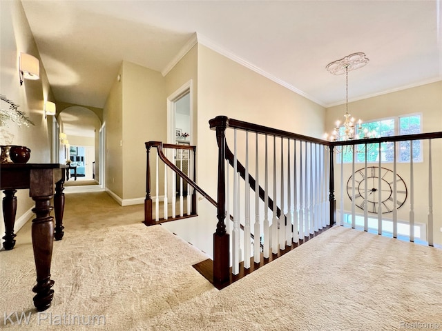 3105 E Woodland Dr, Port Huron, MI 48060 - hall featuring carpet flooring, an upstairs landing, arched walkways, a chandelier, and ornamental molding