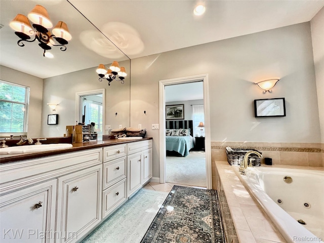 3105 E Woodland Dr, Port Huron, MI 48060 - ensuite bathroom with a chandelier, double vanity, a jetted tub, and tile patterned floors