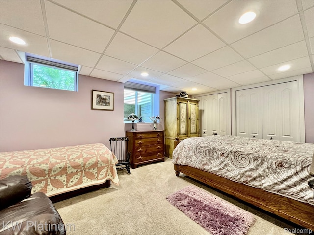 3105 E Woodland Dr, Port Huron, MI 48060 - bedroom with a paneled ceiling, multiple closets, light carpet, multiple windows, and recessed lighting