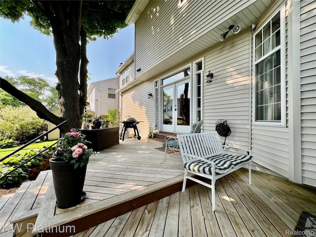 3105 E Woodland Dr, Port Huron, MI 48060 - wooden terrace featuring french doors and grilling area