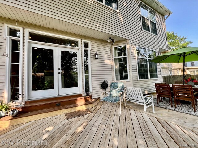 3105 E Woodland Dr, Port Huron, MI 48060 - deck featuring french doors and outdoor dining space
