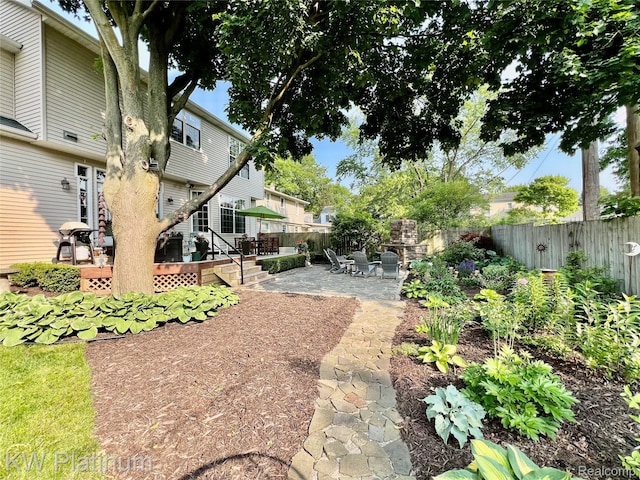 3105 E Woodland Dr, Port Huron, MI 48060 - fenced backyard featuring a patio area, a wooden deck, and a residential view