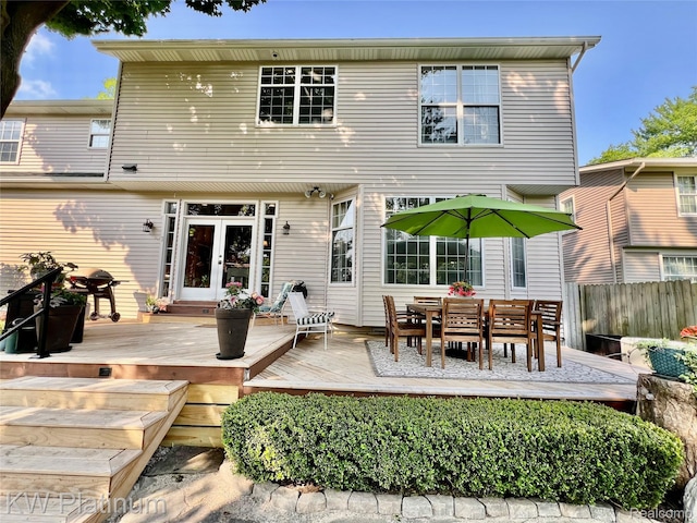 3105 E Woodland Dr, Port Huron, MI 48060 - rear view of house featuring a deck, french doors, and outdoor dining area