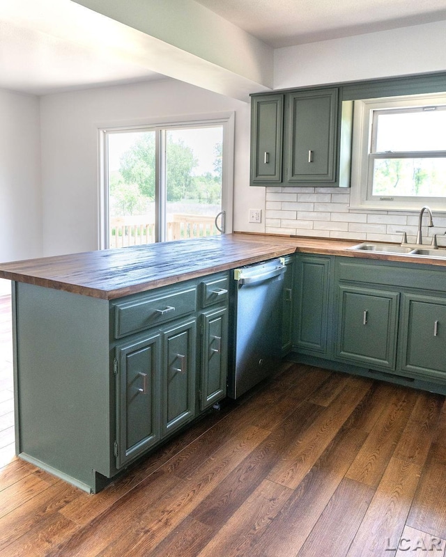1443 N Posey Lake Rd, Hudson, MI 49247 - kitchen featuring butcher block countertops, stainless steel dishwasher, a sink, dark wood finished floors, and plenty of natural light