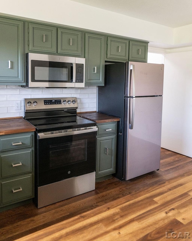 1443 N Posey Lake Rd, Hudson, MI 49247 - kitchen with appliances with stainless steel finishes, green cabinets, wooden counters, backsplash, and dark wood finished floors