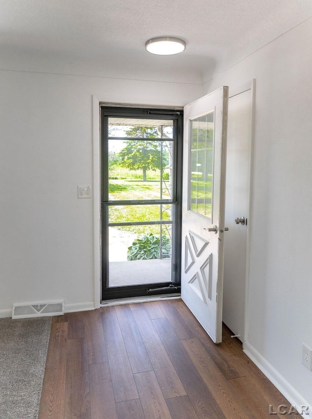 1443 N Posey Lake Rd, Hudson, MI 49247 - entryway with dark wood-style flooring and baseboards