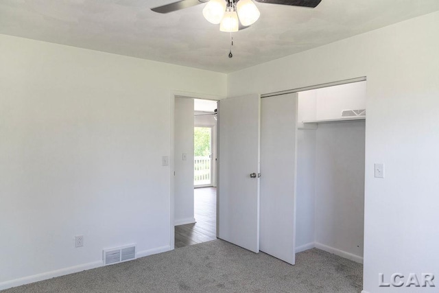 1443 N Posey Lake Rd, Hudson, MI 49247 - unfurnished bedroom with light carpet, baseboards, a closet, and a ceiling fan