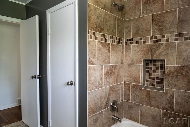 1443 N Posey Lake Rd, Hudson, MI 49247 - full bath with shower / washtub combination, wood finished floors, and baseboards