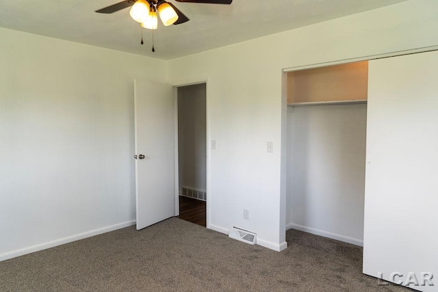 1443 N Posey Lake Rd, Hudson, MI 49247 - unfurnished bedroom featuring carpet flooring, a closet, baseboards, and a ceiling fan