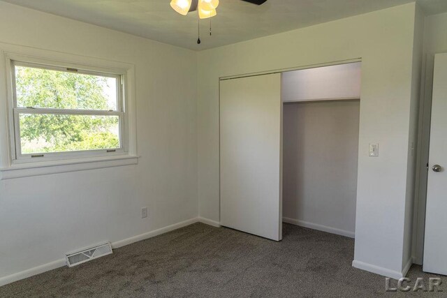 1443 N Posey Lake Rd, Hudson, MI 49247 - unfurnished bedroom with carpet floors, baseboards, and a closet