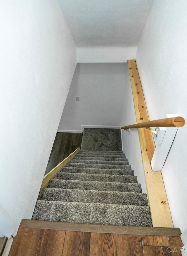 1443 N Posey Lake Rd, Hudson, MI 49247 - stairway with wood finished floors