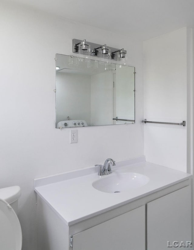 1443 N Posey Lake Rd, Hudson, MI 49247 - bathroom with vanity and toilet