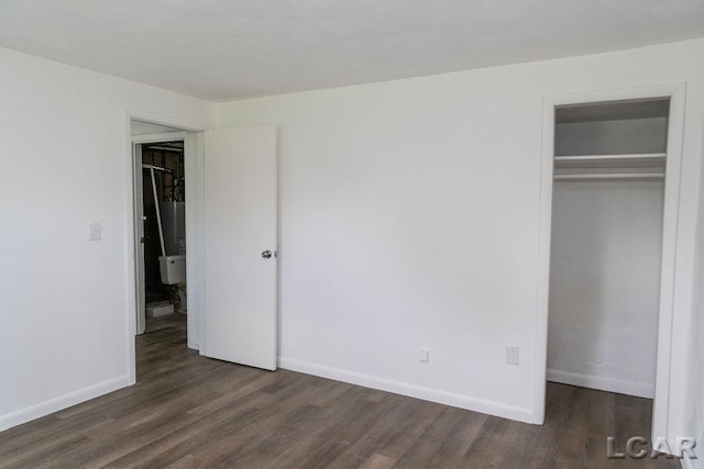 1443 N Posey Lake Rd, Hudson, MI 49247 - unfurnished bedroom with wood finished floors, a closet, and baseboards