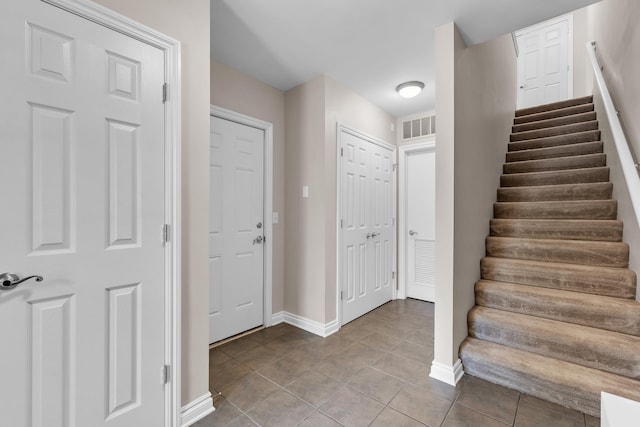 3366 Endsleigh Ln, Ypsilanti, MI 48197 - stairs with tile patterned flooring and baseboards