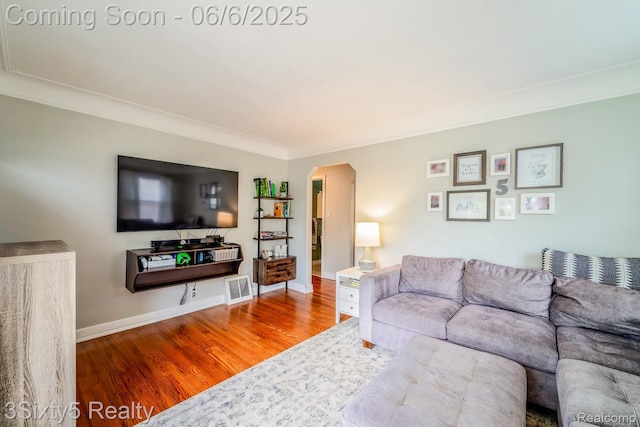 3831 Durham Rd, Royal Oak, MI 48073 - living room with wood finished floors, arched walkways, ornamental molding, and baseboards