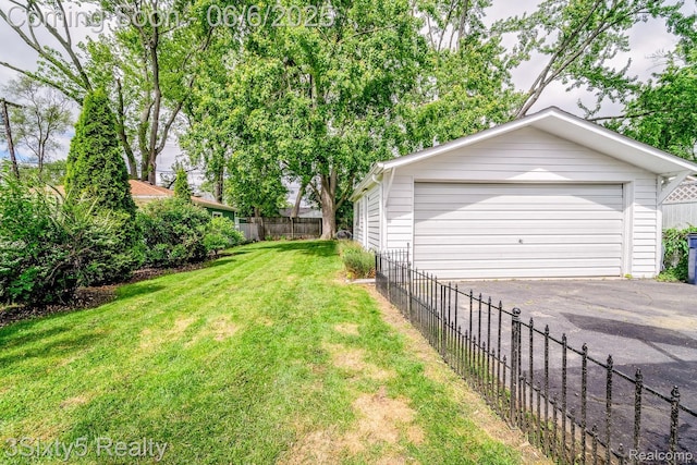 3831 Durham Rd, Royal Oak, MI 48073 - view of yard featuring a garage and an outdoor structure