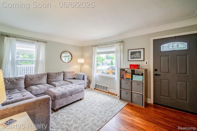 3831 Durham Rd, Royal Oak, MI 48073 - living area featuring wood finished floors, baseboards, and crown molding