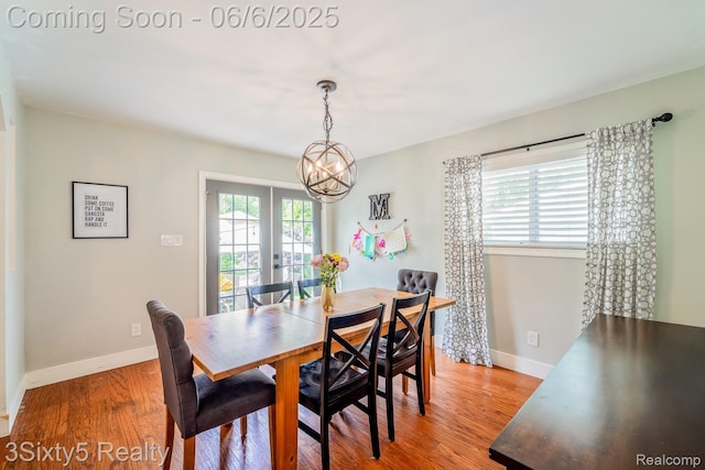 3831 Durham Rd, Royal Oak, MI 48073 - dining area featuring a chandelier, baseboards, and light wood-style floors