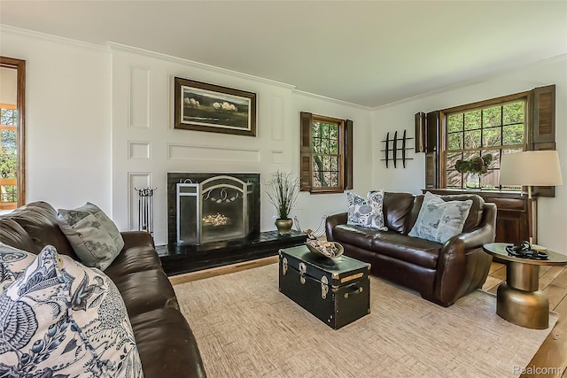 2694 Wayside Dr, Ann Arbor, MI 48103 - living room featuring crown molding, healthy amount of natural light, a fireplace with raised hearth, and wood finished floors