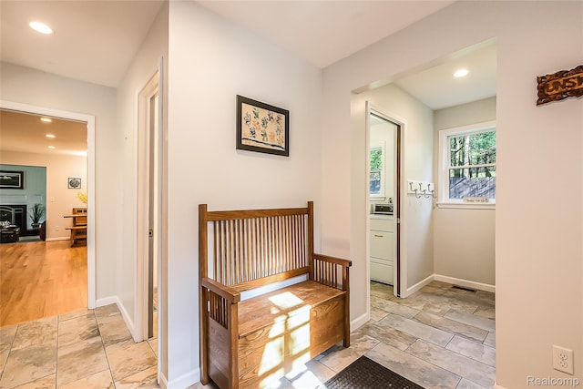 2694 Wayside Dr, Ann Arbor, MI 48103 - hall with recessed lighting, baseboards, and stone tile floors