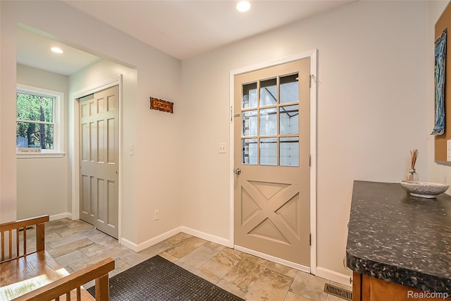 2694 Wayside Dr, Ann Arbor, MI 48103 - doorway with baseboards, recessed lighting, and stone tile flooring