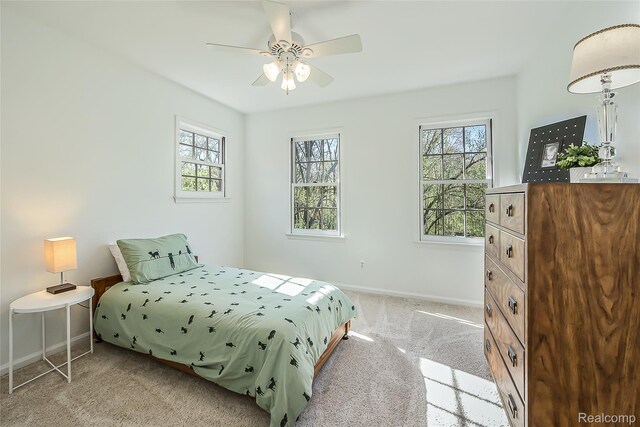 2694 Wayside Dr, Ann Arbor, MI 48103 - carpeted bedroom featuring baseboards and a ceiling fan